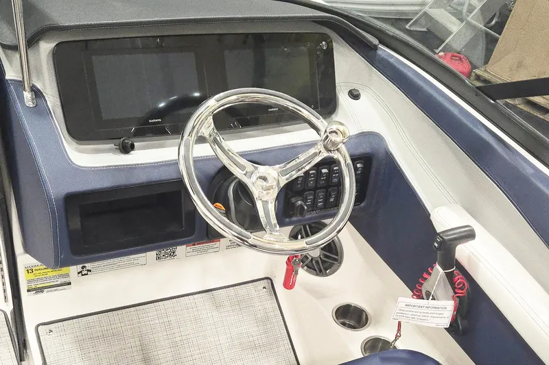 Slide: The Image of 2026 Regal LX2 boat dashboard with steering wheel and control panel. - 6