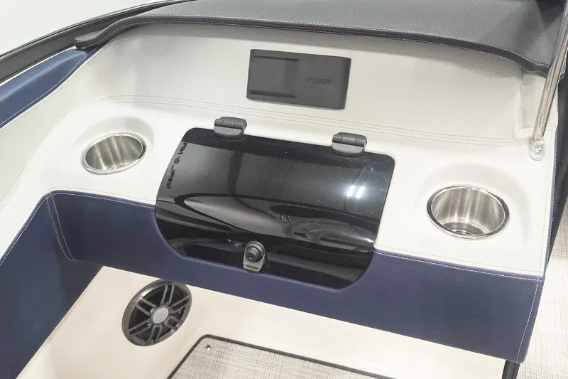 Slide: The Image of 2026 Regal LX2 boat interior with cup holders and speaker system. - 9