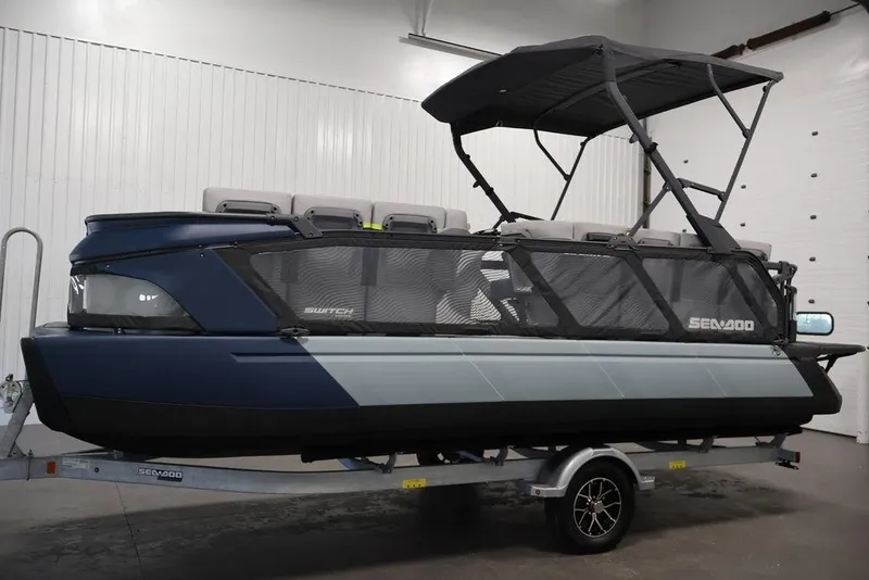 Slide: The Image of 2025 Sea-Doo Switch Cruise Limited 21 pontoon boat on trailer in indoor setting. - 23