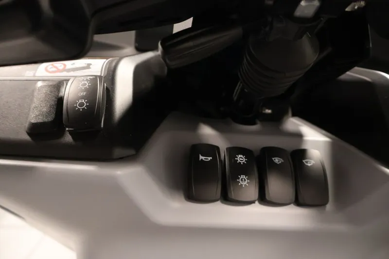 Slide: The Image of Control panel of 2025 Sea-Doo Switch Cruise Limited 21 with various switches and buttons. - 24
