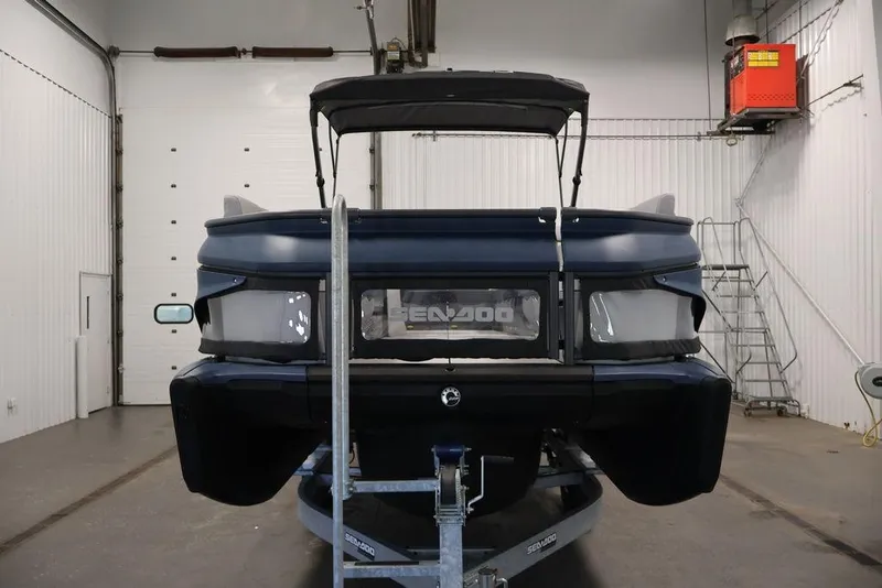 Slide: The Image of 2025 Sea-Doo Switch Cruise Limited 21 in a garage, rear view on trailer. - 30