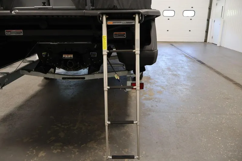 Slide: The Image of Rear view of 2025 Sea-Doo Switch Cruise Limited 21 with boarding ladder extended. - 11
