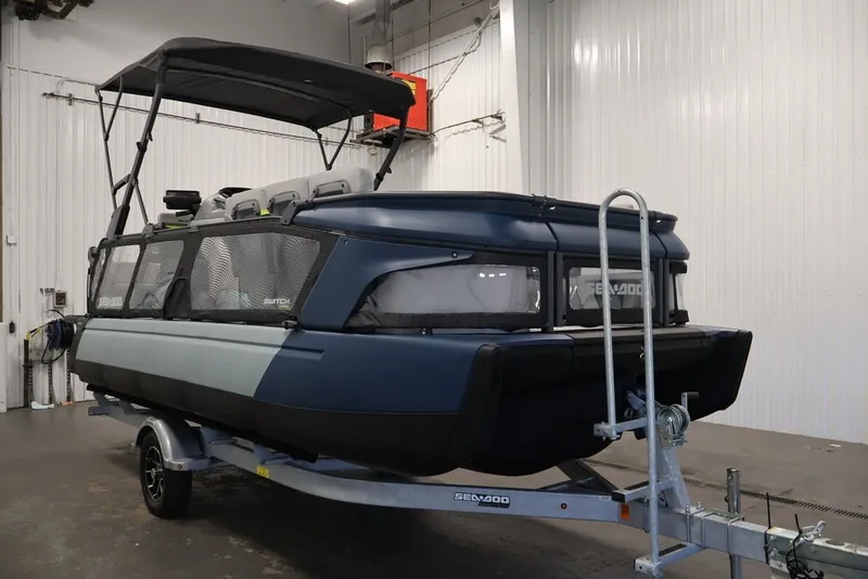 Slide: The Image of 2025 Sea-Doo Switch Cruise Limited 21 pontoon boat on trailer in indoor setting. - 43