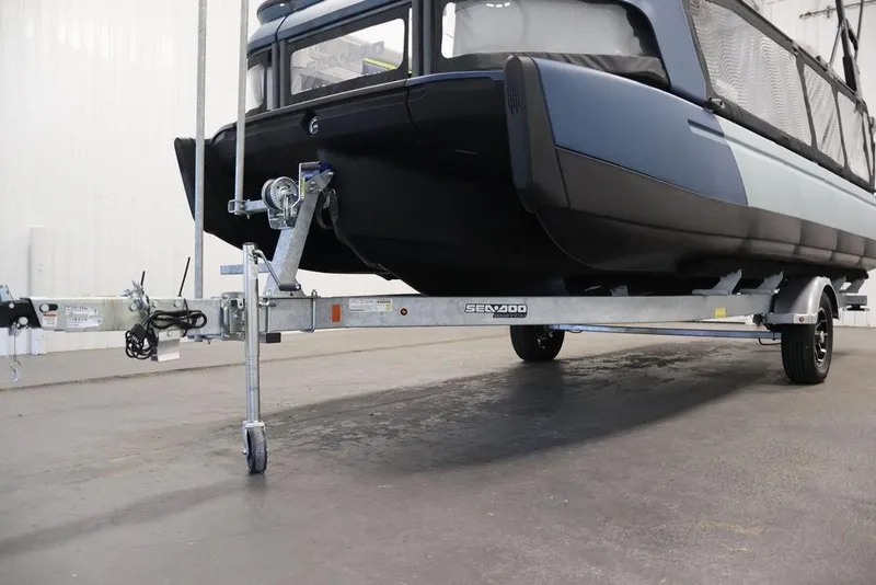 Slide: The Image of 2025 Sea-Doo Switch Cruise Limited 21 on trailer in indoor setting. - 16