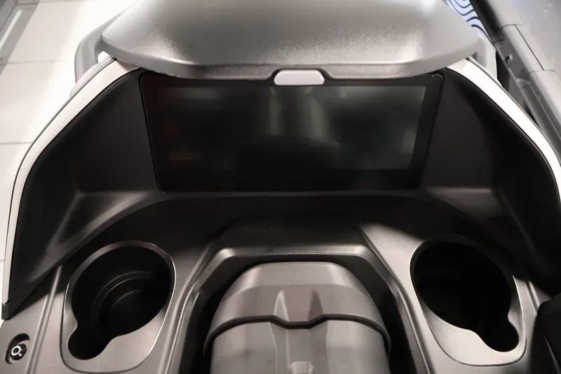 Slide: The Image of Dashboard of 2025 Sea-Doo Switch Cruise Limited 21 with cup holders and display screen. - 34