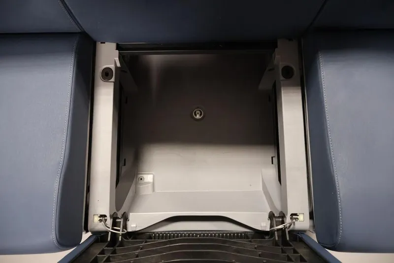 Slide: The Image of Interior storage compartment of 2025 Sea-Doo Switch Cruise Limited 21, featuring blue seating. - 25