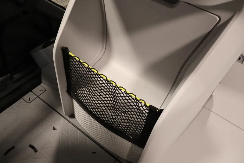 Slide: The Image of 2025 Sea-Doo Switch Cruise Limited 21 interior storage compartment with netting. - 28