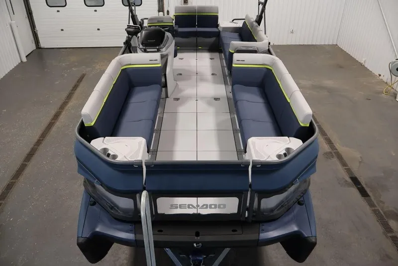 Slide: The Image of 2025 Sea-Doo Switch Cruise Limited 21 pontoon boat with spacious seating and modern design. - 27