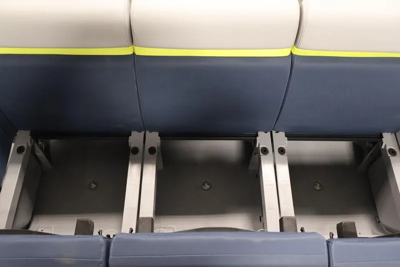 Slide: The Image of 2025 Sea-Doo Switch Cruise Limited 21 seating with blue and white upholstery, showcasing storage compartments. - 19