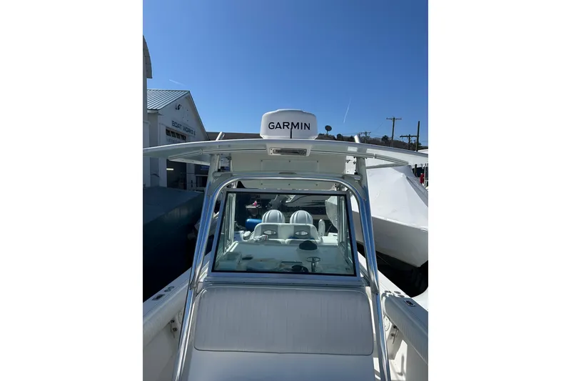 Slide: The Image of 2005 Regulator 32 Forward Seating boat with Garmin equipment under clear blue sky. - 7