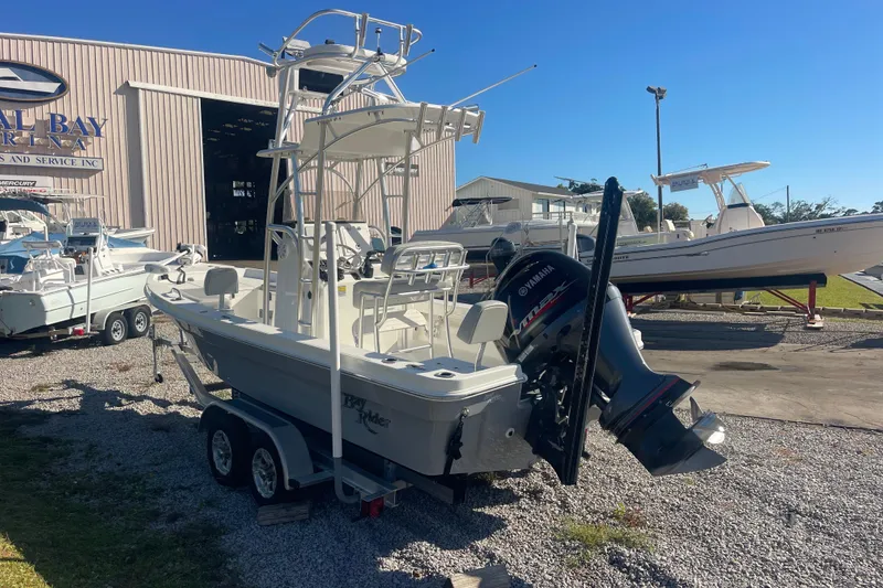 Slide: The Image of 2021 Bay Rider 219 Bay boat with Yamaha engine at a marina. - 11