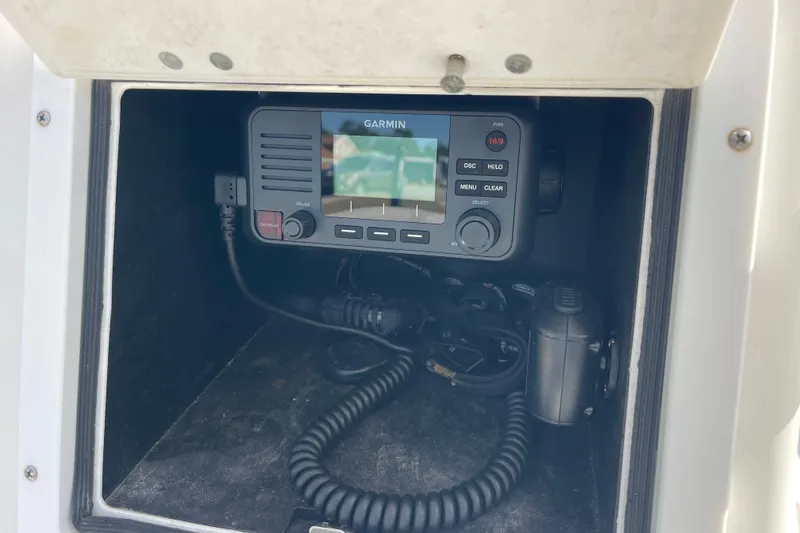 Slide: The Image of Garmin marine radio inside 2021 Bay Rider 219 Bay boat compartment. - 15