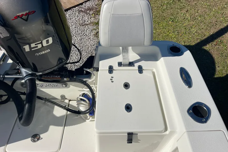 Slide: The Image of 2021 Bay Rider 219 Bay boat with Yamaha 150 engine, rear seating area. - 23