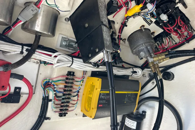 Slide: The Image of Electrical wiring and components inside a 2021 Bay Rider 219 Bay boat. - 24