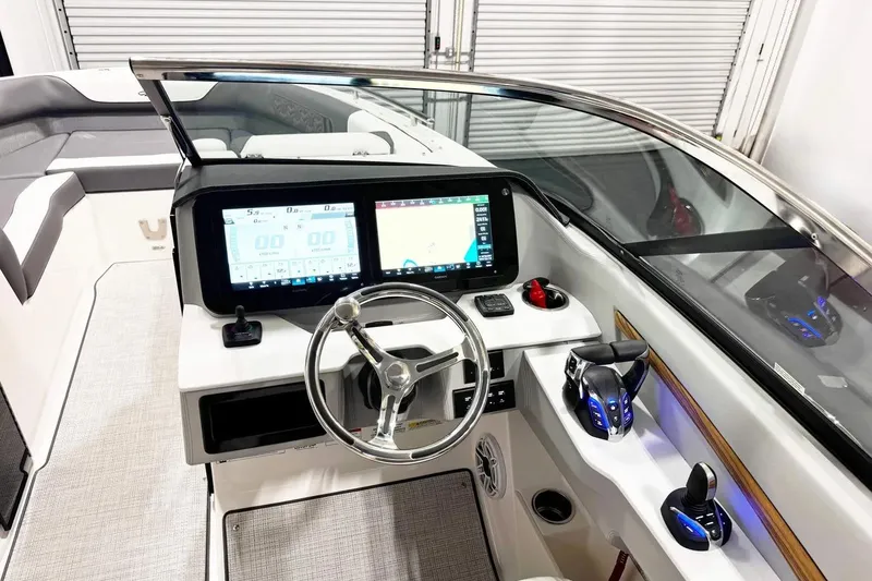 Slide: The Image of 2026 Regal LX9 boat dashboard with modern controls and dual display screens. - 9