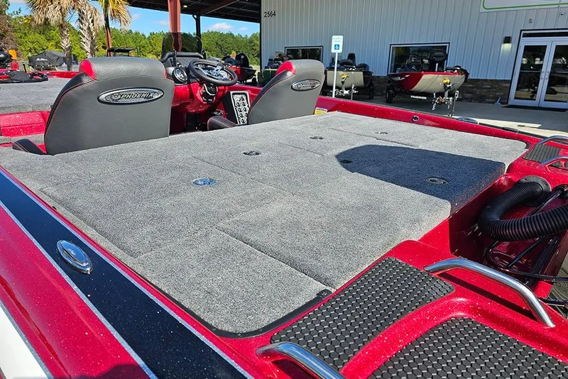 Slide: The Image of 2026 Phoenix 819 ZXL boat with spacious deck and modern seating, parked outdoors. - 10