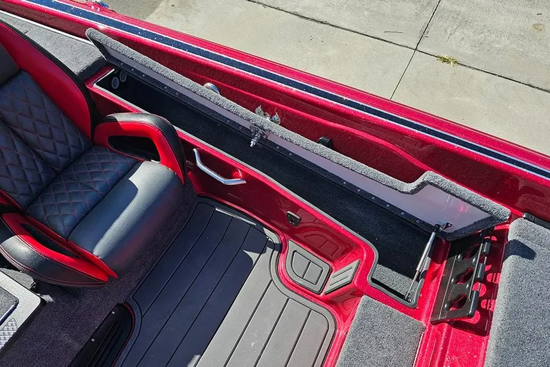 Slide: The Image of Interior of 2026 Phoenix 819 ZXL boat with red and black seating and storage compartments. - 14