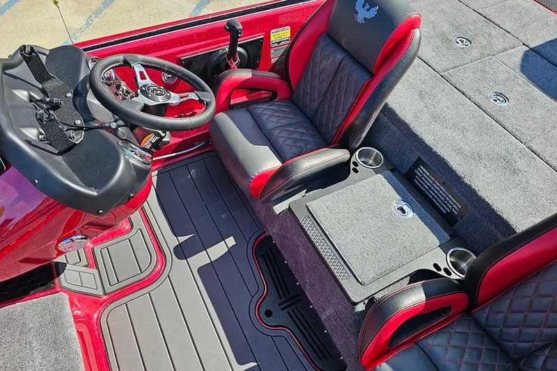 Slide: The Image of 2026 Phoenix 819 ZXL boat interior with red and black seats, steering wheel, and cup holders. - 15