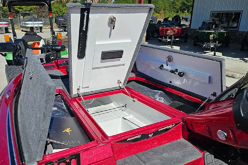 Slide: The Image of Open storage compartments of a 2026 Phoenix 819 ZXL boat, showcasing interior features. - 20