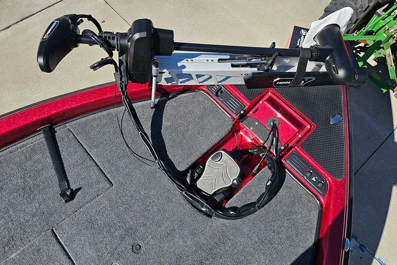 Slide: The Image of Trolling motor on 2026 Phoenix 819 ZXL boat deck, featuring red and gray design. - 21