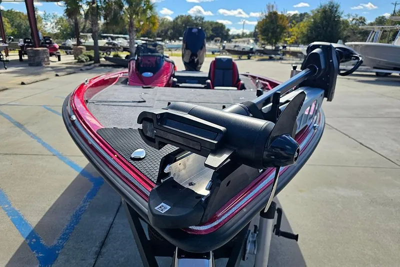 Slide: The Image of 2026 Phoenix 819 ZXL boat with trolling motor in a sunny outdoor setting. - 4