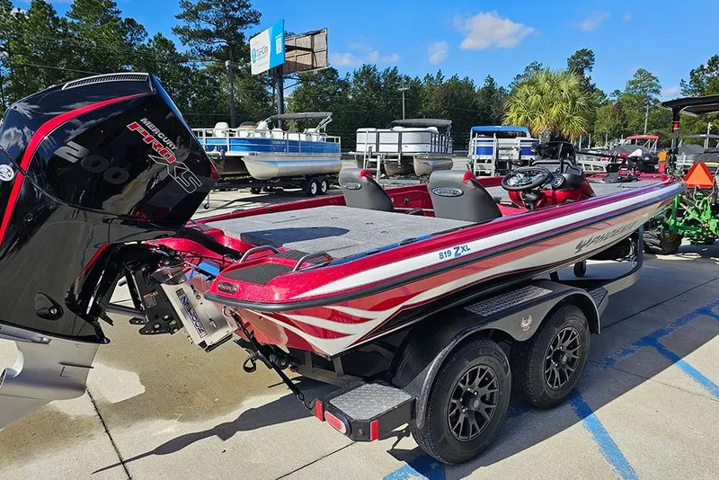 Slide: The Image of 2026 Phoenix 819 ZXL boat with Mercury Pro XS engine, parked on a trailer. - 7