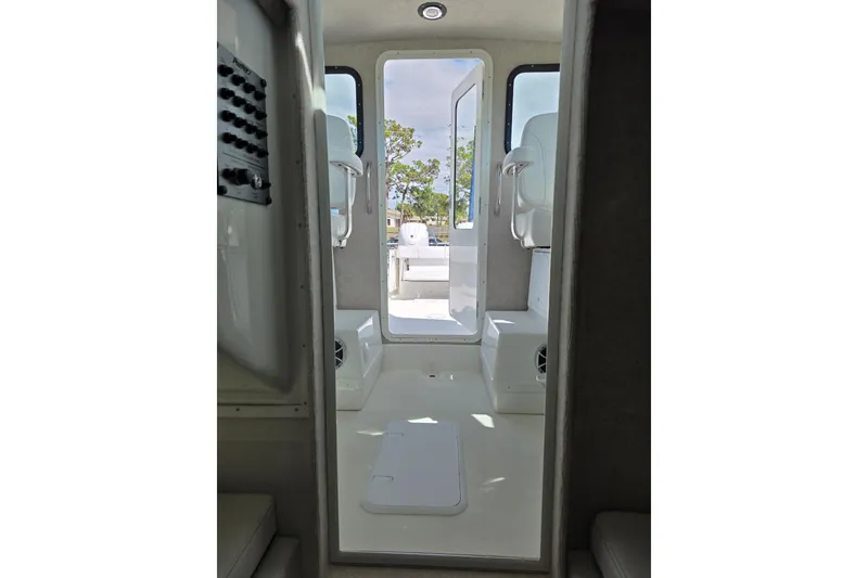 Slide: The Image of Interior view of 2026 Parker 257 Explorer boat, showcasing seating and open door. - 22