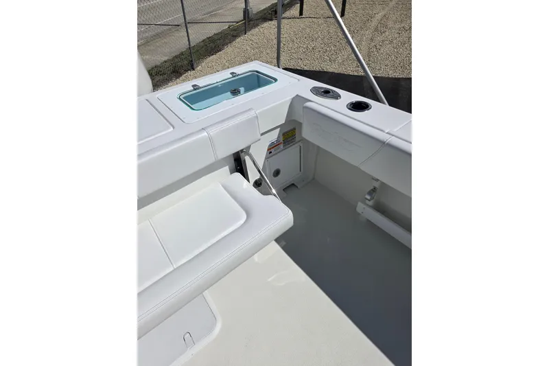 Slide: The Image of 2026 Parker 257 Explorer boat interior with seating and storage compartments. - 26