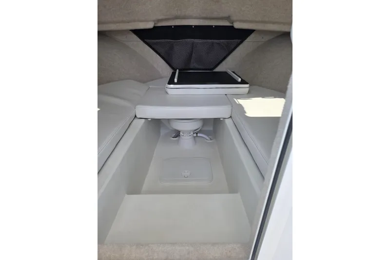 Slide: The Image of Interior cabin of 2026 Parker 257 Explorer boat, featuring seating and storage. - 29