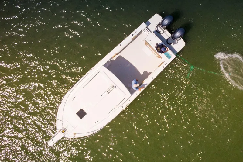 Slide: The Image of Manufacturer Provided Image: Aerial view of 2026 Parker 257 Explorer boat on water with two people onboard. - 3