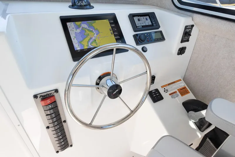 Slide: The Image of Manufacturer Provided Image: Helm of 2026 Parker 257 Explorer with navigation and control systems. - 5