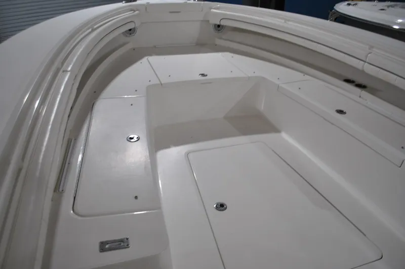 Slide: The Image of 2016 Regulator 34 Center Console boat interior with spacious storage compartments. - 14