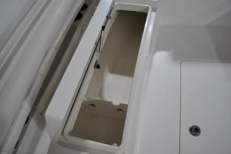 Slide: The Image of Open storage compartment on 2016 Regulator 34 Center Console boat. - 17