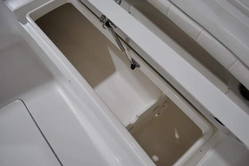 Slide: The Image of Open storage compartment on 2016 Regulator 34 Center Console boat. - 18