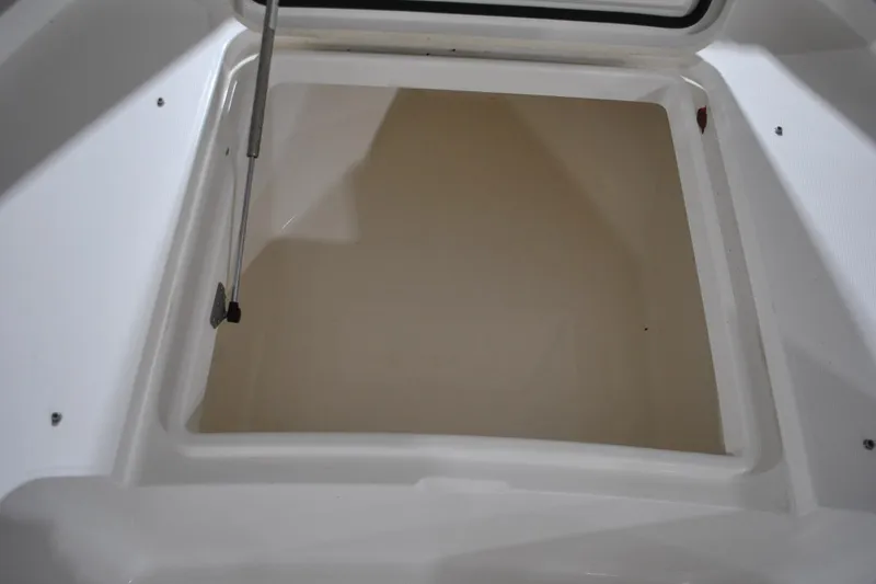 Slide: The Image of Open storage compartment on 2016 Regulator 34 Center Console boat. - 19