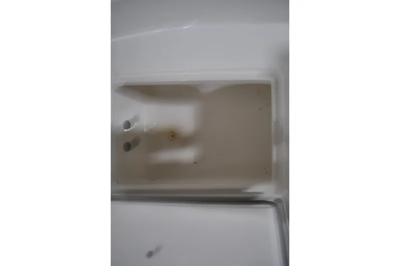 Slide: The Image of Storage compartment of 2016 Regulator 34 Center Console boat, interior view. - 20