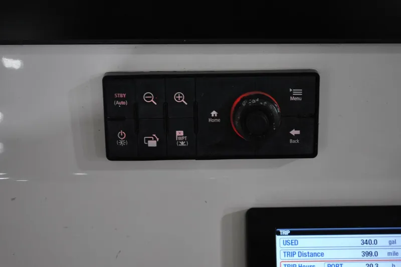 Slide: The Image of Control panel of 2016 Regulator 34 Center Console boat with navigation buttons. - 25