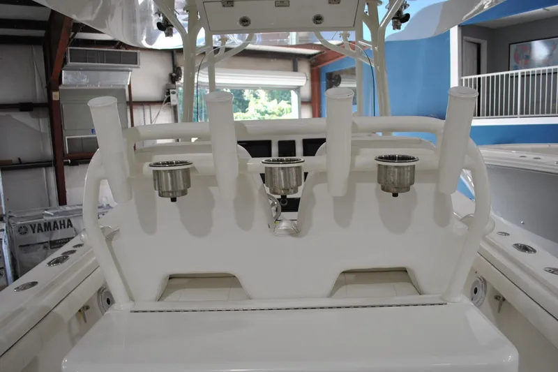 Slide: The Image of 2016 Regulator 34 Center Console boat interior with rod holders and cup holders. - 61
