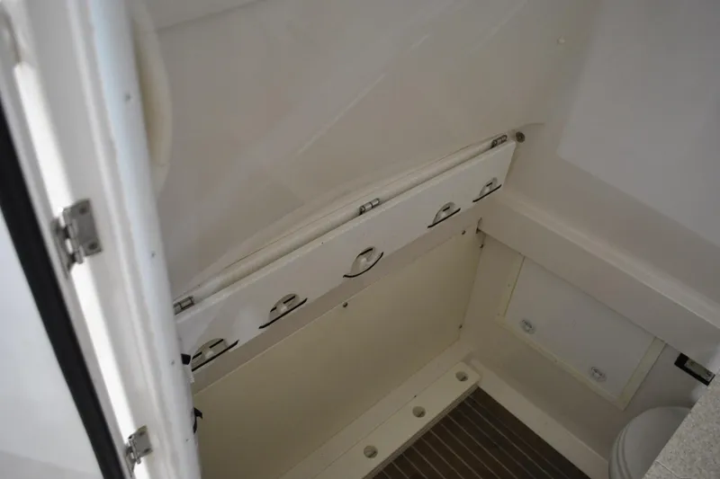 Slide: The Image of 2016 Regulator 34 Center Console interior storage compartment with white finish. - 64