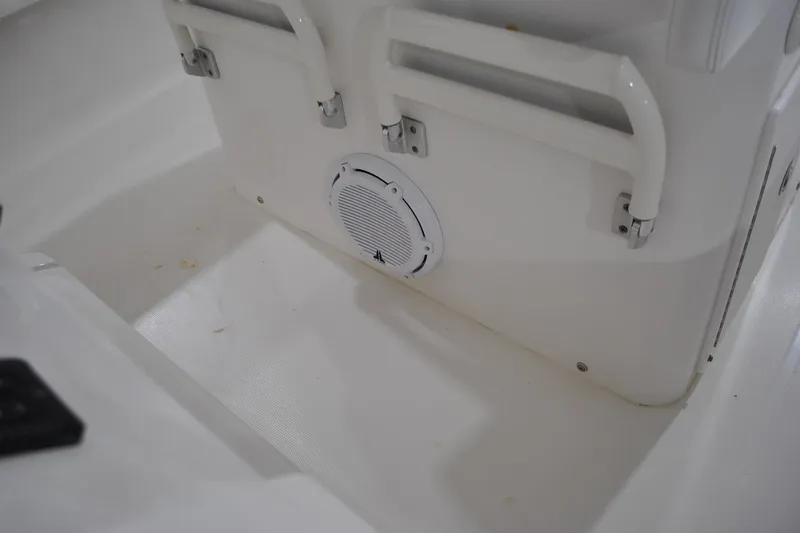 Slide: The Image of 2016 Regulator 34 Center Console interior with speaker and seating area. - 67