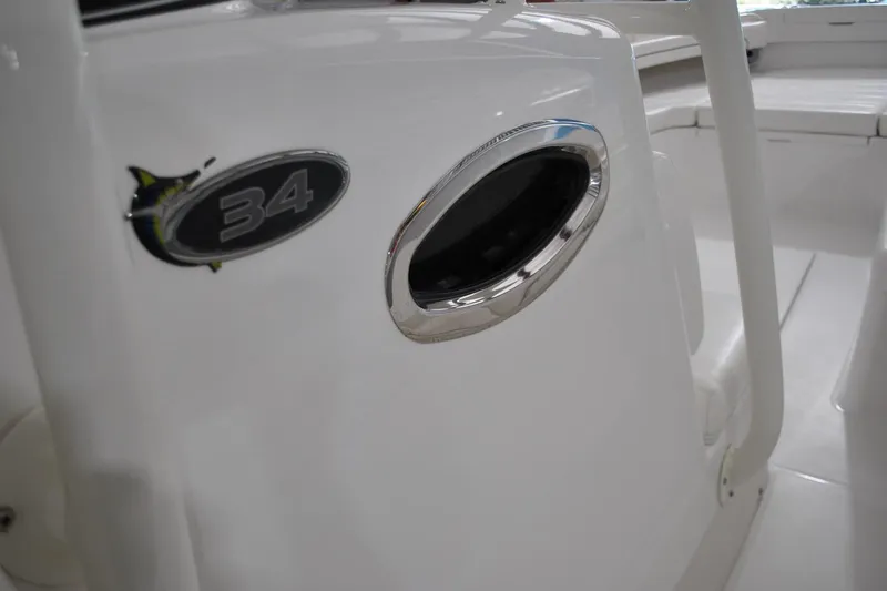 Slide: The Image of 2016 Regulator 34 Center Console boat interior detail with logo and seating. - 68