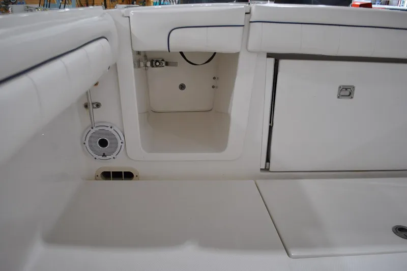 Slide: The Image of 2016 Regulator 34 Center Console interior storage and seating area. - 70