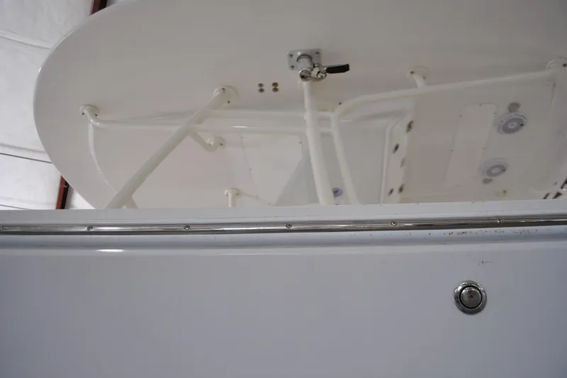 Slide: The Image of 2016 Regulator 34 Center Console boat, close-up of T-top structure and fittings. - 77