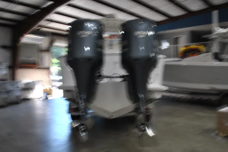 Slide: The Image of Blurry image of a 2016 Regulator 34 Center Console boat in a garage. - 87