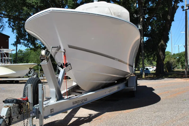 Slide: The Image of 2016 Regulator 34 Center Console boat on trailer, parked outdoors. - 9
