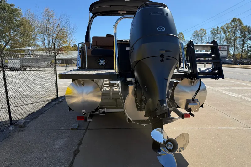 Slide: The Image of 2026 Avalon Catalina Quad Lounger Windshield boat with powerful outboard motor. - 11