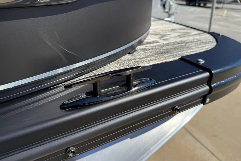 Slide: The Image of 2026 Avalon Catalina Quad Lounger Windshield boat cleat on deck, close-up view. - 18