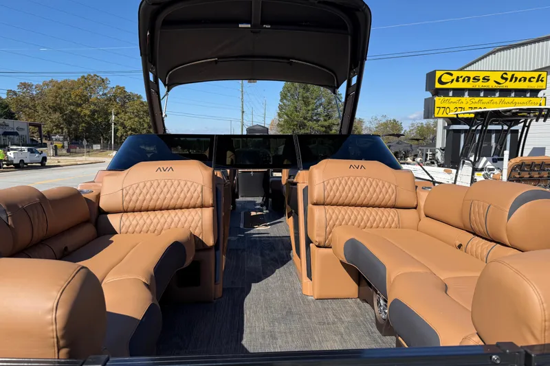Slide: The Image of 2026 Avalon Catalina Quad Lounger Windshield with luxurious tan seating and sleek design. - 22