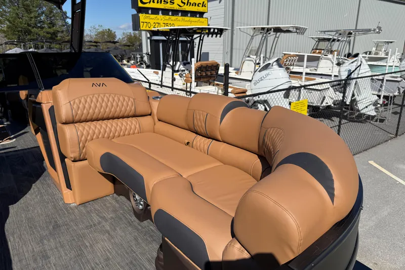 Slide: The Image of Luxurious seating on 2026 Avalon Catalina Quad Lounger Windshield boat, featuring tan leather upholstery. - 23