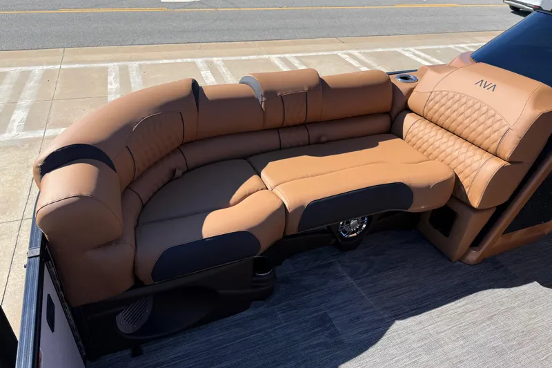 Slide: The Image of Luxurious seating on 2026 Avalon Catalina Quad Lounger Windshield boat, featuring tan upholstery. - 24